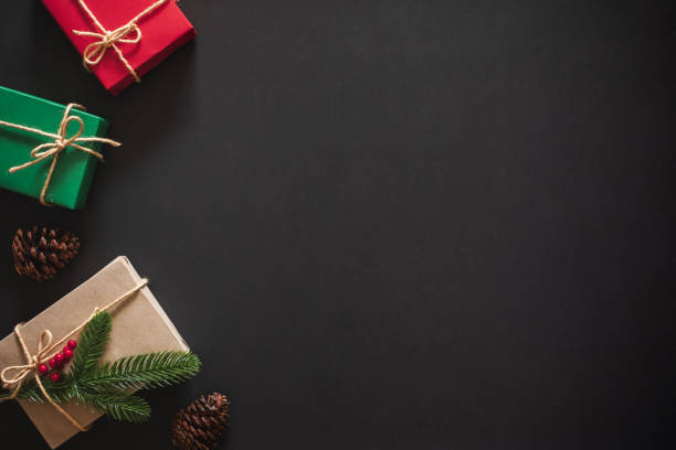 istock Christmas background with gift present over black background with copy space. flatlay topview 1181957356
