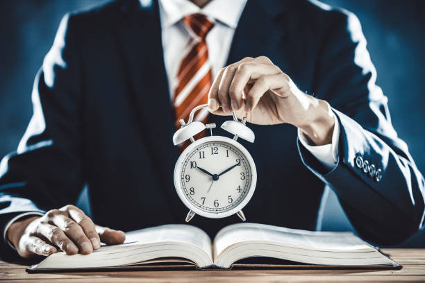 istock Businessman with alarm clock 1181960990