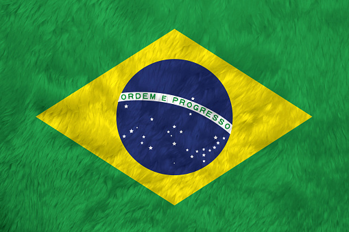 Towel fabric pattern flag of Brazil, Crease of Brazilian flag background, green yellow and blue color and world in center.