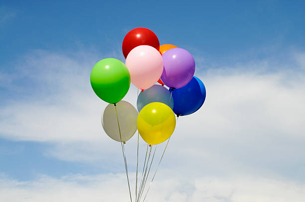 istock Colorful Balloons against a Blue Cloud Sky 118197303