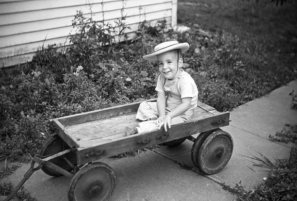 boy in old wagon 1954, retro
