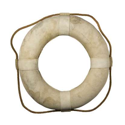 This is an authentic life ring, or life preserver, from World War II. It was used aboard the USS Wharton. Isolated with clipping path on white background.