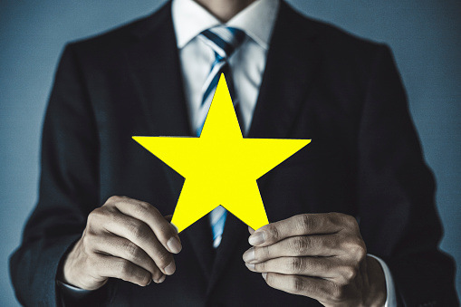 Businessman with a star in hand