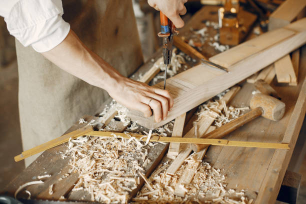 istock Handsome carpenter working with a wood 1181976430