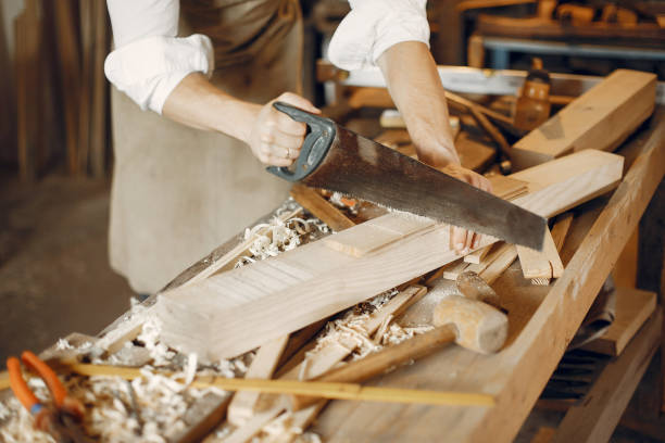 istock Handsome carpenter working with a wood 1181976478