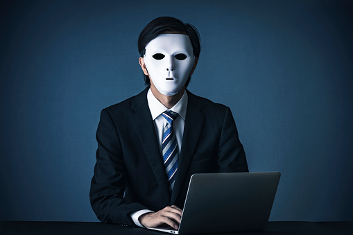 Businessman with a white mask