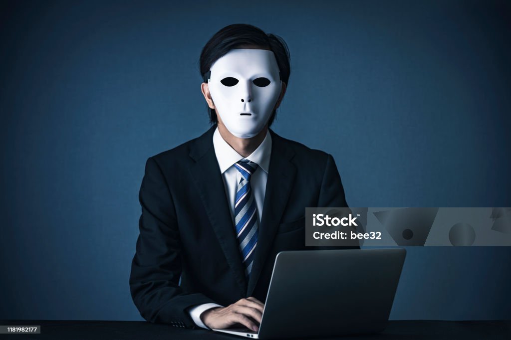 Businessman with a white mask Dishonesty Stock Photo