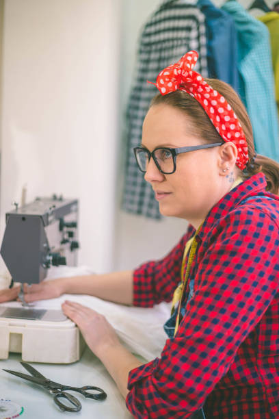 istock Seamstress woman preparing material 1181982833