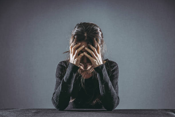 istock Thinking woman in black clothes 1181985427