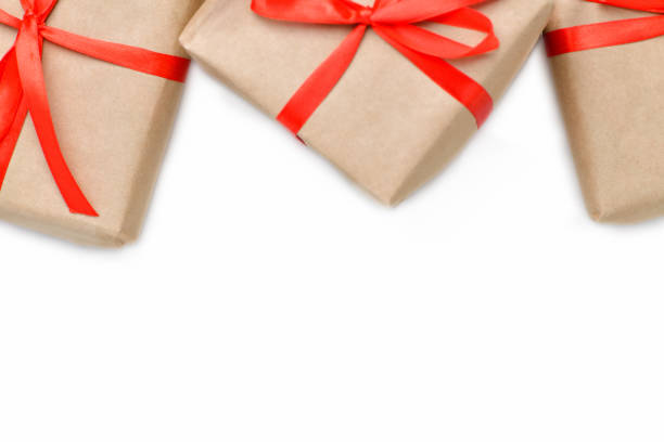istock Three gift boxes with red ribbon on isolated white background. New year and Christmas 1181987190