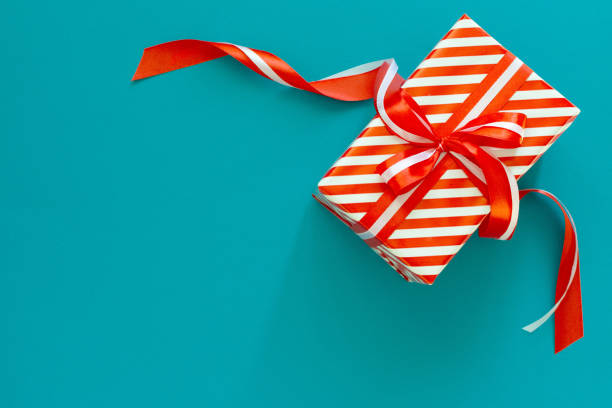 istock Background with red and white striped gift box 1181987199