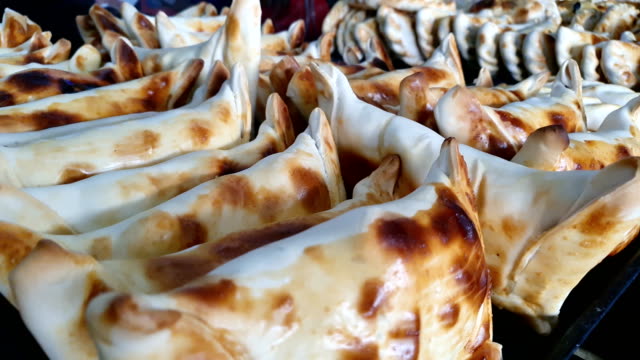 Close up of many Beef filled Empanada or Empanada de Pino, delicious Chilean baked pasty