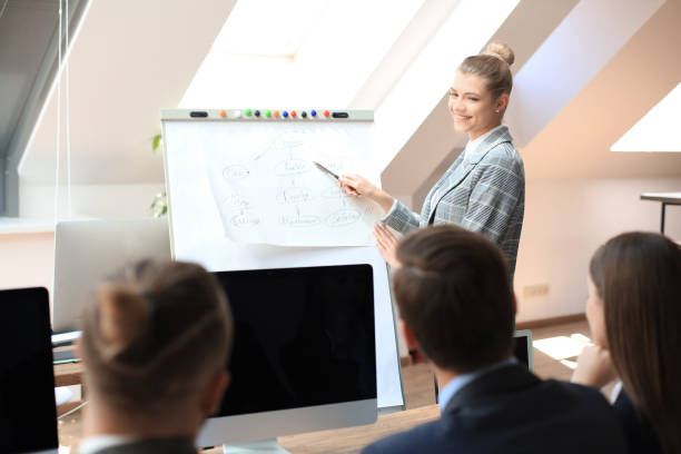 istock Business conference presentation with team training flipchart office. 1181990843