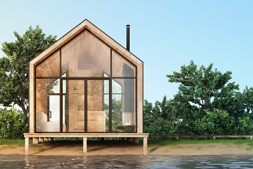 A small minimalist modern house in Scandinavian style with large panoramic Windows and wood trim on the waterfront. 3D illustration.