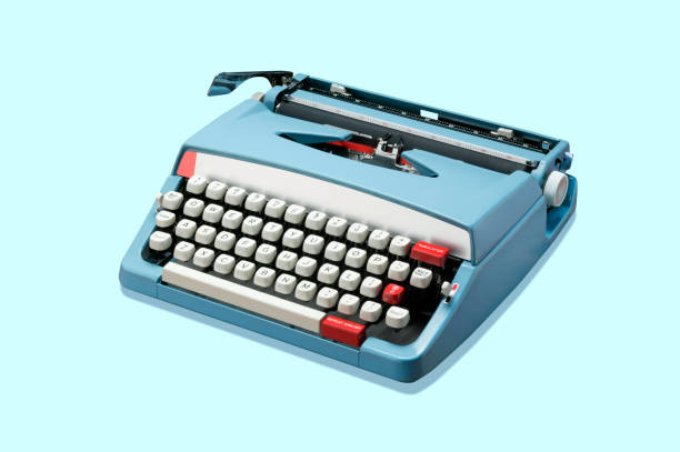 typewriter on blue background - electric typewriter imagens e fotografias de stock