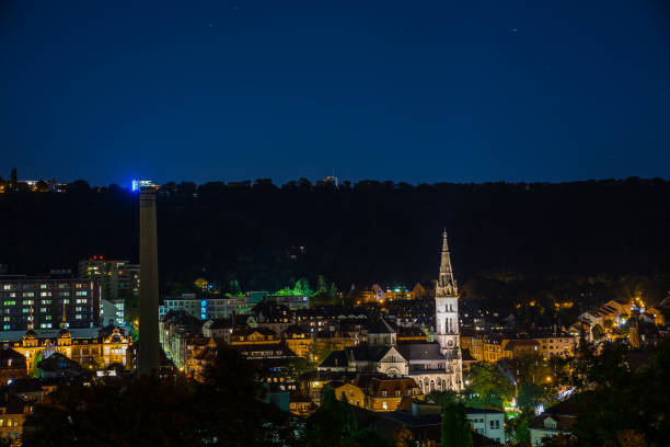 istock Germany, Beautiful night view over stuttgart district heslach, the erwin schoettle platz and the mathaeuskirche, a beautiful cathedral, seen from above by night with starry sky 1181991221