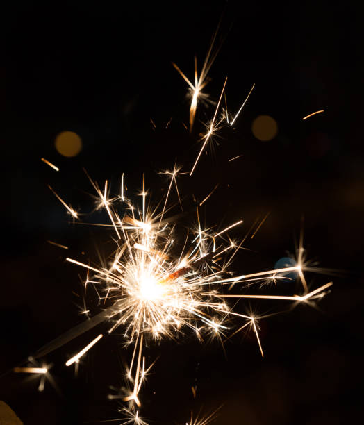 istock Bengal fire sparkles isolated on black background. 1181992464