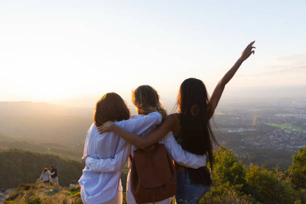 istock Women on mountain peak cliff 1181994370