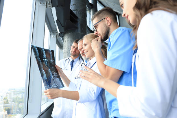 istock Group of doctors checking x-rays in a hospital. 1181994744
