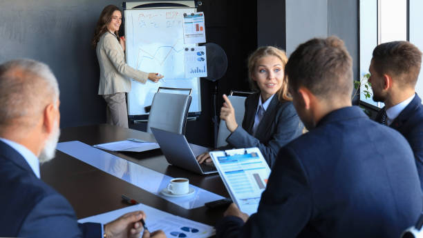 istock business conference presentation with team training flipchart office. 1181998013