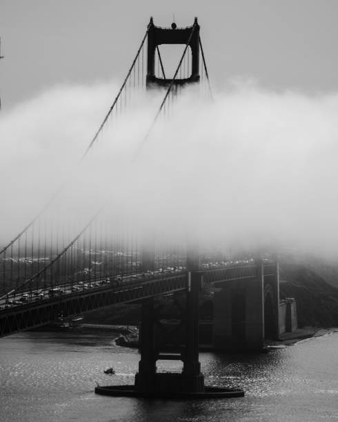 Black and white Golden Gate Bridge with fog