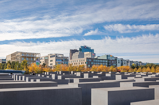 Berlin, Germany, October 6, 2019: View of Memorial to the murdered Jews of Europe in Berlin. It is also known as Holocaust Memorial. On one hand a popular tourist destination and on the other hand a memoral for on of the darkest periods of European history. The monument is designed by the architect Peter Eisenman and the engineer Buro Happold.