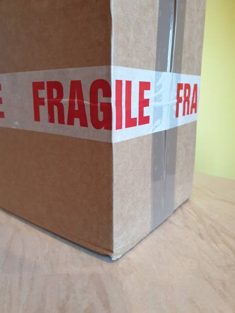 istock Cardboard box with fragile tape 1182009961