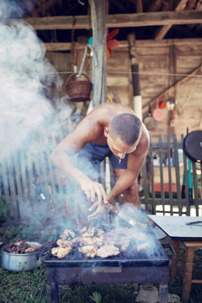 istock Barbecue making outdoors on a regular / vintage grill. 1182011227