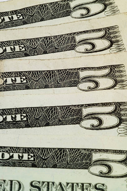 istock Spread of five dollar bills close up 118201150