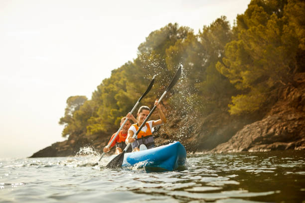 istock Couple enjoying kayaking during summer vacation 1182011546
