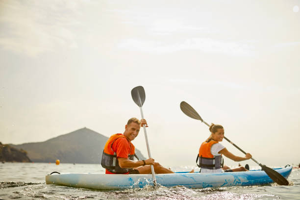 istock Couple kayaking on river during summer 1182011550