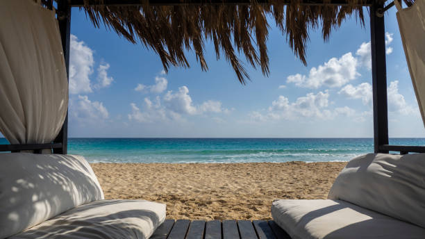 Marsa Matruh, Egypt. Elegant gazebo on the beach. Amazing sea with tropical blue, turquoise and green colors. Relaxing context. Nobody on the beach. Fabulous holidays. Mediterranean Sea. North Africa stock photo