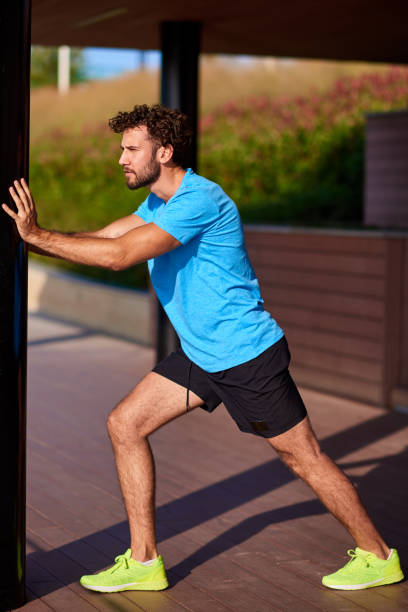 istock Man stretching and exercising in urban surroundings. 1182012492