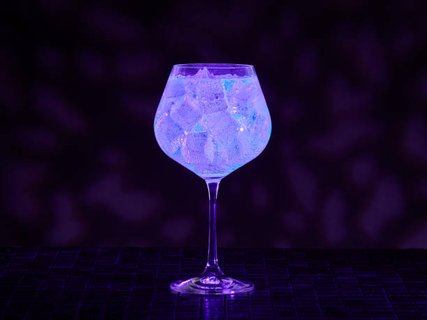 Gin tonic under UV illumination stock photo