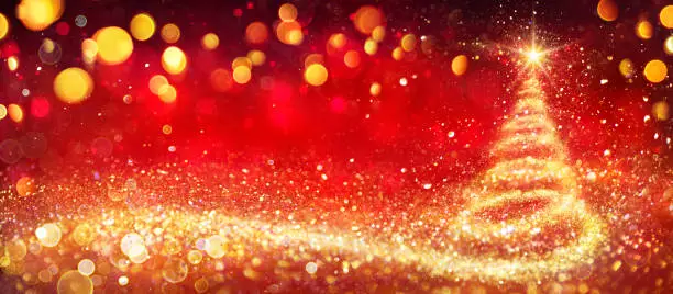 Photo of Golden Christmas Tree In Red Festive Background