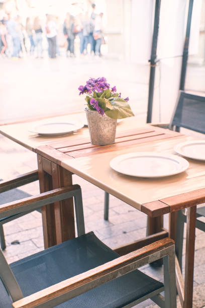istock table with tablecloth and dishes from a restaurant on the street 1182013459