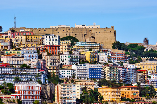 Castel Sant Elmo and the colorful apartment houses of Vomero in Naples, Italy