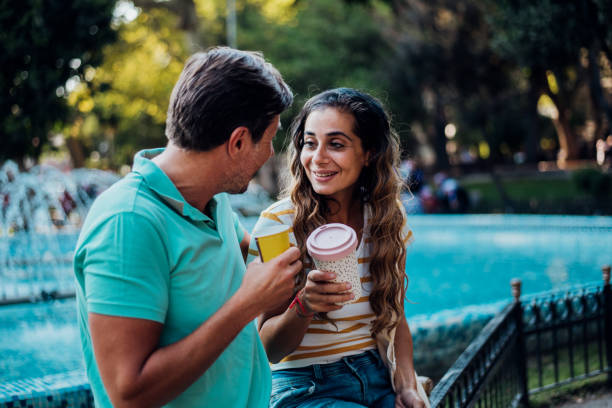 istock Arab couple enjoying coffee at the park 1182015107