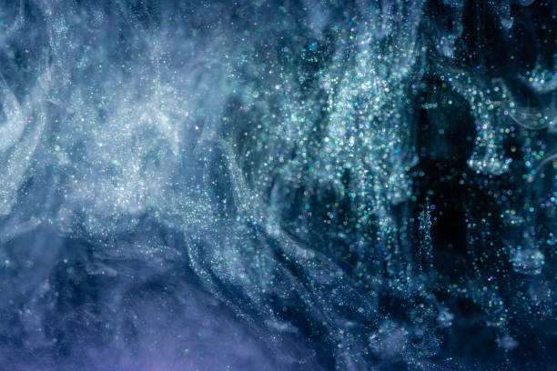 istock Shiny acrylic ink with glitter floating in the water 1182015899