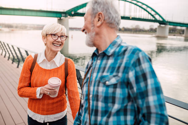istock Seniors walking by the river 1182016031