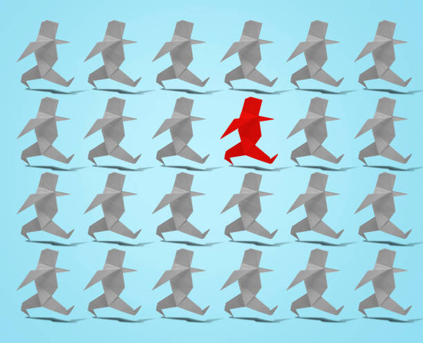 istock Walking paper Man in origami with a red one on blue background. 1182016084