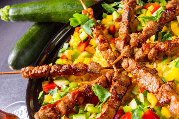istock Lamb skewers with curry rice and different vegetables 1182018500