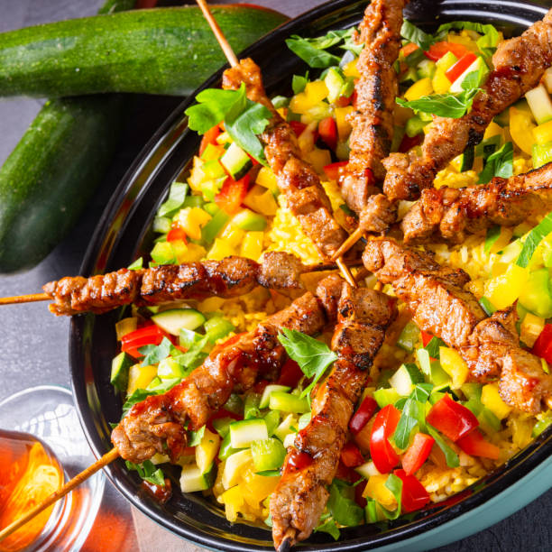 istock Lamb skewers with curry rice and different vegetables 1182018653