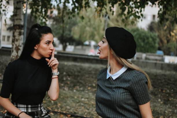 istock Happy female friends reading 1182018712