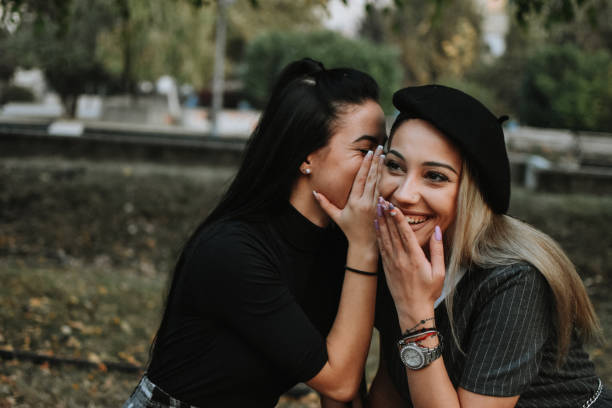 istock Happy female friends reading 1182018722