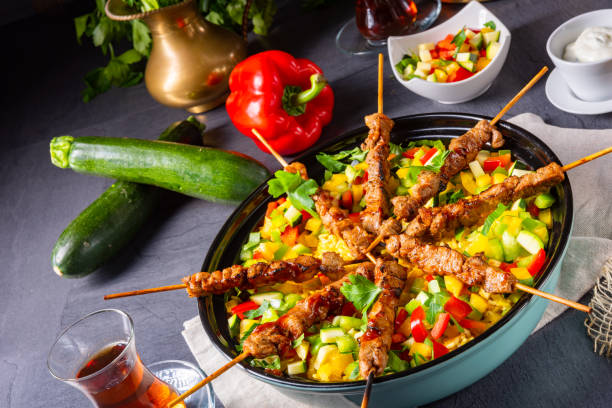 istock Lamb skewers with curry rice and different vegetables 1182018750