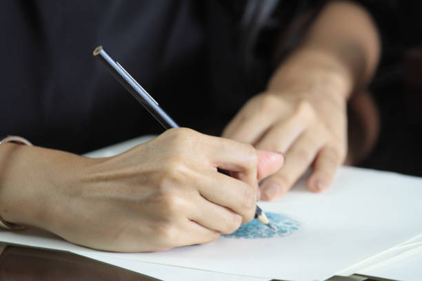 istock close up of right hand drawing 2 1182019780