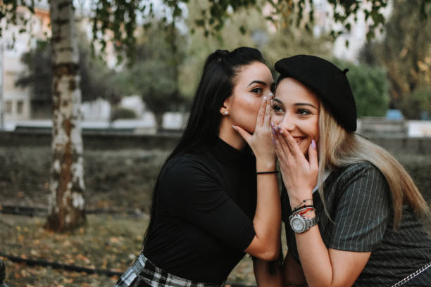 istock Happy female friends reading 1182020655