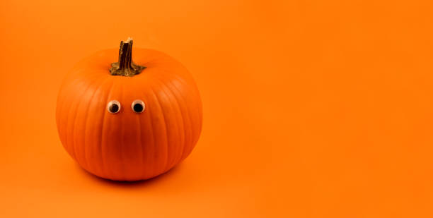 Cute Halloween pumpkin with eyes stock images