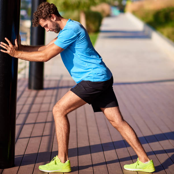 istock Man stretching and exercising in urban surroundings. 1182021944